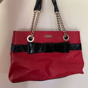 Red Kate Spade tote with black bow accent/chain
